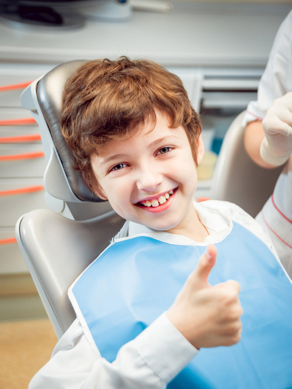 Little boy smiling in the dental office.